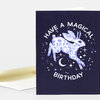 A dark greeting card with a leaping jackalope illustration, scattered stars and moon, and the text "HAVE A MAGICAL BIRTHDAY" in white lettering.