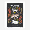 A black poster-style print titled "WOLVES" showing three illustrated wolves labeled 1, 2, and 3 amid colorful leaf and berry motifs, with species names printed at the bottom and "PAPIO PRESS" in the lower right.