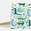 A folded greeting card with a repeating crocodile and tropical leaf pattern and the text "SNAPPY BIRTHDAY!" on the front.