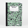 A spiral-bound composition notebook with a mint green cover patterned with small black doodles and a white label that reads "COMPOSITION NOTEBOOK."