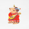 A mouse-shaped ornament with a gold hanging loop, wearing a red dress and blue hat while holding a yellow stringed instrument.