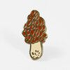 A gold-toned enamel pin shaped like a morel mushroom with orange-red and cream sections and a black outline.