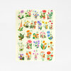 A rectangular playsilk printed with the alphabet A through Z, each letter paired with a colorful fairy or child figure and a different flower illustration.