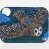 A rectangular tray with rounded corners printed with an illustration of a child riding on a flying owl under a moon and stars.