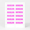 A sheet of rectangular stickers or labels printed repeatedly with the word "ANALOG" in bright magenta retro-style lettering.