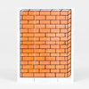 A rectangular rubber stamp block printed with an orange brick wall pattern outlined in black, shown as a single block with no visible text.