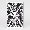 A sheet of black-and-white cat stamps with multiple stylized cat faces arranged in a radial pattern separated by dotted lines.