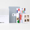 A boxed set labeled "The Artist Series No. 11 - 20" with a gray slipcase, a white booklet, and several artist stamp sheets with colorful abstract and figurative designs.