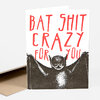 A folded greeting card with a black-and-white bat illustration and large red text reading "BAT SHIT CRAZY FOR YOU."