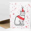 A folded greeting card shows a black line drawing of a cat wearing a red party hat and a red sash that reads "HAPPY B-DAY," surrounded by red confetti-like marks.