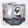 A hardcover book titled "HOW TO MAKE FRIENDS WITH A GHOST" by Rebecca Green, with an illustrated cover showing a girl on a swing next to a smiling ghost.