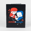 A hardcover book with a black cover featuring two stylized illustrated figures in red and blue and the title "Jorinde & Joringel" in large text.