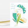 A folded greeting card featuring a stylized teal moth and abstract leaf shapes with the words "you smell good" on the front.