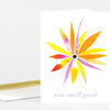 A white greeting card with a colorful radiating flower illustration and the text "you smell good" in pale purple script.
