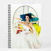 A spiral-bound notebook with a white cover showing a collage-style illustration of a seated woman in a white dress surrounded by multiple hands offering teacups.
