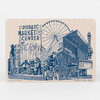 A rectangular beige coaster or card shows a blue line-art collage of Seattle landmarks and street scenes with legible text including "PUBLIC MARKET CENTER," "SEATTLE," "PARAMOUNT," and "Navigating Downtown Seattle."