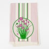 A folded off-white cloth with vertical pink and green stripes and a central circular print of green chive stems with pink blossoms, with the text "VICTORYGARDENOFTOMORROW.COM" at the bottom.