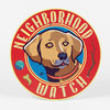 A round red sign with a yellow border featuring a brown dog illustration and the text "NEIGHBORHOOD WATCH".
