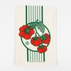 A cream-colored square cloth printed with vertical green stripes and clusters of red tomatoes with green leaves.