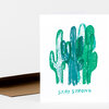 A white greeting card featuring an illustrated cluster of green and teal cacti with the words "STAY STRONG" printed below.