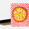 A folded greeting card with a colorful illustrated pizza and the word "THANK" in large white letters across the slice, with a matching envelope partially visible behind it.