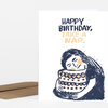 A folded birthday card reads "HAPPY BIRTHDAY, TAKE A NAP." above an illustration of a person hugging a patterned cake.
