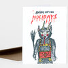 A folded greeting card with the text "BRING ON THE HOLIDAYS" above an illustrated horned creature with a furry body, red cheeks, and a patterned outfit.