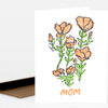 A folded greeting card with a hand-drawn floral bouquet in orange, green, and black and the word "mom" printed below.