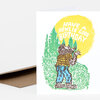 A folded greeting card shows a werewolf-like figure in a forest with the text "HAVE A HOWLIN' GOOD BIRTHDAY" on the front.