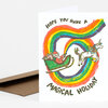 A folded holiday card with a colorful rainbow loop design, a Santa in a sleigh, a unicorn, and the text "HOPE YOU HAVE A MAGICAL HOLIDAY" on the front.