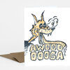 A folded greeting card with an illustrated cartoon wolf head and the text "AWOOO OOGA" in large block letters on the front.