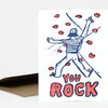 A greeting card with an illustrated climber and the words "YOU ROCK" in large red letters.