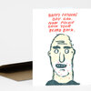A folded greeting card with a simple illustrated bald man’s face and the text "HAPPY FATHER'S DAY DAD. NOW PLEASE GROW YOUR BEARD BACK."
