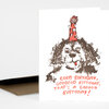 A folded birthday greeting card with a stylized dog wearing a red party hat and the printed message "GOOD BIRTHDAY, GOOOOOD BIRTHDAY, THAT'S A GOOOOD BIRTHDAY!" on the front.