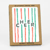 A boxed set of six letterpress printed cards with kraft envelopes, featuring vertical red and green stripes and the word "CHEER" in large dark letters on the front card.