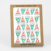 A boxed set of six letterpress printed holiday cards with a cover design of colorful Christmas hats spelling "MERRY HAPPY JOLLY CHEER PEACE" and the text "w/ KRAFT ENVELOPES".