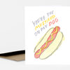 A folded greeting card with a hand-drawn hot dog illustration and the text "YOU'RE THE MUSTARD ON MY DOG".