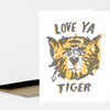 A folded greeting card with a stylized tiger face illustration and the text "LOVE YA TIGER" on the front.
