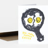 A folded greeting card shows a black hand-drawn face with two yellow smiley eyes and the text "YOU MAKE THINGS EASIER" in yellow on the front.