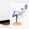 A folded greeting card with a hand-drawn illustration of a woman holding up a birthday cake and the text "HAPPY BIRTHDAY... AND BREATHE."
