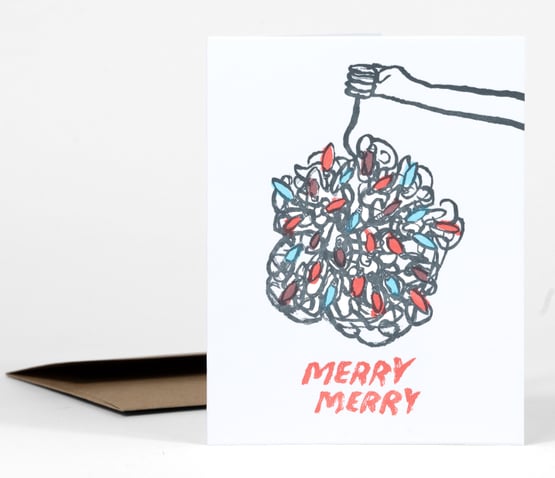 A holiday card with a hand holding up a tangled bundle of string lights and the text "MERRY MERRY" in red below.